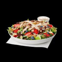 Market Salad · Sliced grilled chicken breast served on a fresh bed of mixed greens, topped with crumbled bl...
