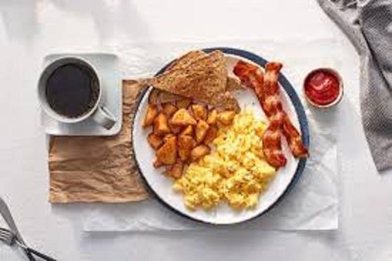 Two Egg Breakfast · Cage free eggs, choice of apple-wood smoked bacon or breakfast sausage with breakfast potatoes and toast.