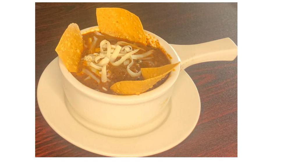 Chili · Our house-made chili served with grated cheddar and crispy tortillas.
