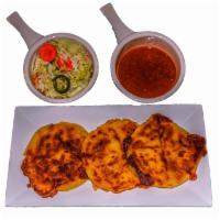 Bean and Cheese Pupusas · 3 corn flour pupusas made from scratch and stuffed with cheese and refried beans. Served wit...