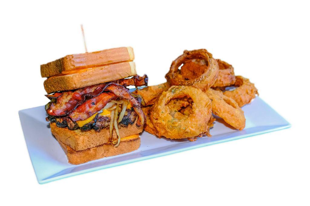 Duffy's Famous Monster Burger · Huge fresh, never frozen, Angus burger cooked between 2 grilled cheese sandwiches with lettuce, tomato, bacon and onion, cooked to order with choice of side.