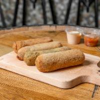 Ham Homemade Croquetas Breakfast · Rolled in breadcrumbs and fried. Cooked meat from the upper part of a pig's leg.