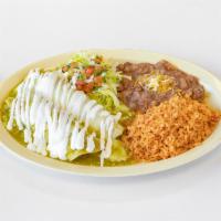 Enchilada Plate · 2 enchiladas, chicken or cheese, red or green sauce  cheese and sour cream served with rice,...