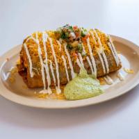 Steak Chimichanga · Served with guacamole, sour cream and cheddar cheese.