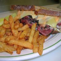 Pastrami Reuben Sandwich · Swiss, sauerkraut, and Russian dressing. Served with French fries.