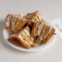 Turkey Club Sandwich · Over gold turkey on 3 toasted slices.