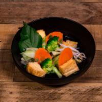 Soup Rau Chay · Vegetarian soup with an assortment of vegetables and floating deep-fried tofu in a steamy bo...