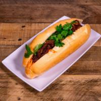 BM5. Banh Mi Thit Nuong · Freshly baked French bread with char-grilled sliced pork dressed with julienne carrots and t...