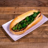 BM7. Banh Mi Ga Nuong · Freshly baked French bread with our Vietnamese style seasoned char-grilled chicken and dress...