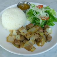 CM4. Com Bo Luc Lac · Stir-fried marinated tender beef cubes with yellow onions. Served with a small vinaigrette l...