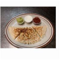 Chicken Quesadilla · Chicken, Cheddar Cheese, and onions in a flour tortilla. Served with Guacamole, sour cream, ...