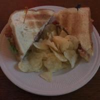BLT · Bacon, lettuce, tomato, and mayo on white bread. Served with potato chips.