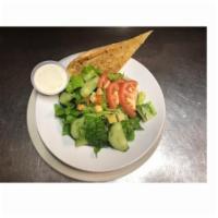 Garden Salad · Romaine lettuce topped with tomatoes, cucumbers, carrots, and croutons. Served with Garlic B...