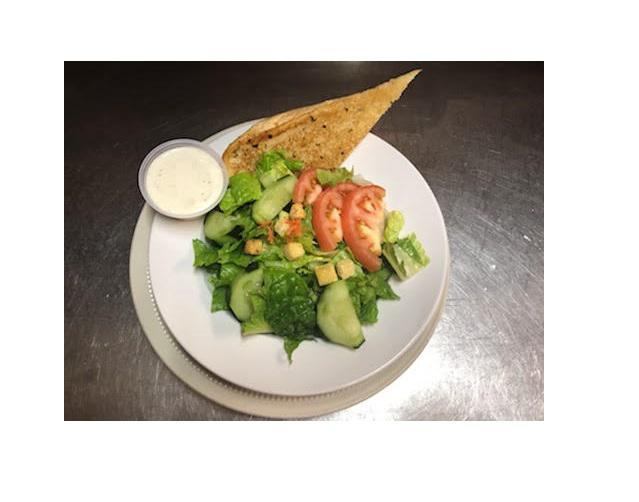Garden Salad · Romaine lettuce topped with tomatoes, cucumbers, carrots, and croutons. Served with Garlic Bread.