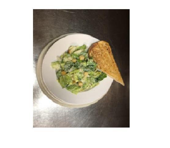 Caeser Salad · Romaine lettuce topped with Caeser dressing, Parmesan cheese and croutons. Served with Garlic Bread.