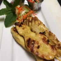  Chicken Satay · Skewer and grilled marinated chicken in Thai Style curry sauce. served with Peanut sauce and...