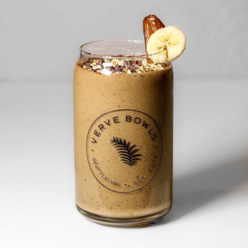 Chagaccino Smoothie · Chagaccino - made with wild foraged chaga, organic peruvian cacao, and organic ceylon cinnamon - bananas, dates, almond butter and vanilla protein blended with our house-made-made almond milk.