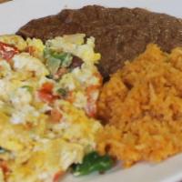 Huevos ala Mexicana · Scrambled eggs, jalapenos, tomatoes and 3 tortillas. Served with rice and beans.