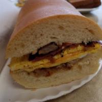 Hungry Man Sandwich heros · 3 eggs, sausage, bacon and ham.