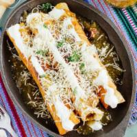 Chicken Flauta · Lettuce, sour cream, coteja cheese, rice and beans.