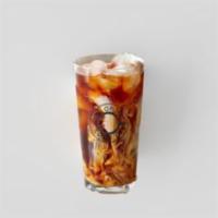 Iced Chai Latte · Dona masala chai is slow steeped with ginger, cinnamon, green cardamom, cloves, black pepper...