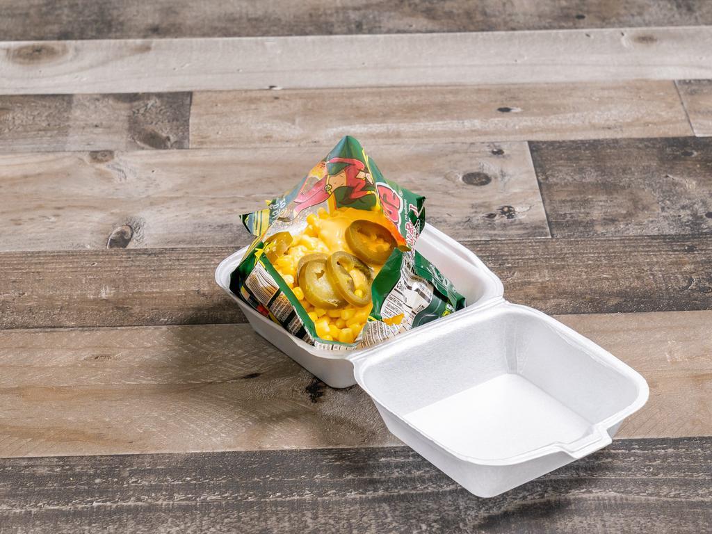 3. Las Conchitas · Conchitas chips, yellow corn, nacho cheese, sour cream and jalapeno or Valentina Sauce.