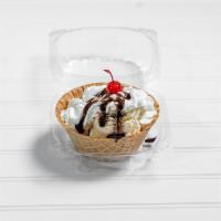 Canasta de Nieve · 3 ice cream balls in sugar basquet, covered in whipped cream and cherry on top.