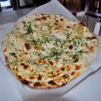 GARLIC NAAN · White flour, flaky bread from tandoor with garlic and cilantro