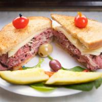 Reuben Sandwich · Choice of pastrami or corned beef, melted Swiss cheese, sauerkraut, and Russian dressing ser...