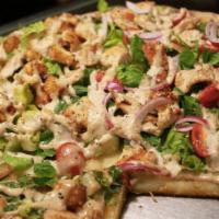 Caesar Salad Pizza by the slice · Best of both  - pizza and Caesar salad. Romaine lettuce, grilled chicken, Caesar dressing, c...