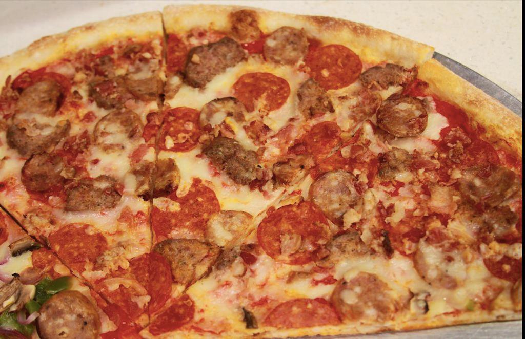 Meat lover Pizza by the slice · Meat eater's favorite. Mix of 3 meats on a bed of mozzarella and homemade sauce.