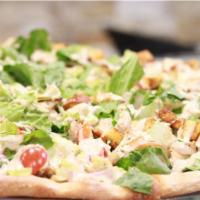 Chicken Caesar Salad Pizza · Romaine lettuce, char-grilled chicken, Caesar dressing and croutons.