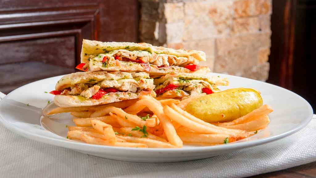 Italiano · Grilled chicken, prosciutto, roasted peppers and pesto. Served with fries and pickles.
