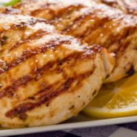 Grilled Chicken breast/ pechuga a la parrilla · With Rice & beans or moro or tostones