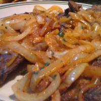 Steak with onion/Bistec Encebollado · With Rice & beans or moro or tostones