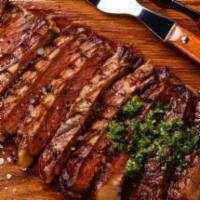 Churrasco/ Skirt steak · With Rice & beans or moro or tostones