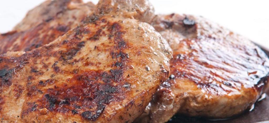 Grilled pork chop/ chuleta a la Parilla · With Rice & beans or moro or tostones