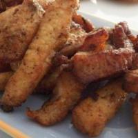 Carnita de Cerdo frita/ fried pork · With Rice & beans or moro or tostones