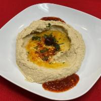 Hummus · Mashed Garbanzo beans, tahini, yogurt, minced garlic, olive oil and lemon juice. Served with...