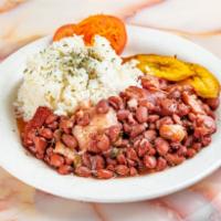 Stew Peas · Pieces of stew pork and oxtail emerged in a bed of red peas simmered to perfection.

