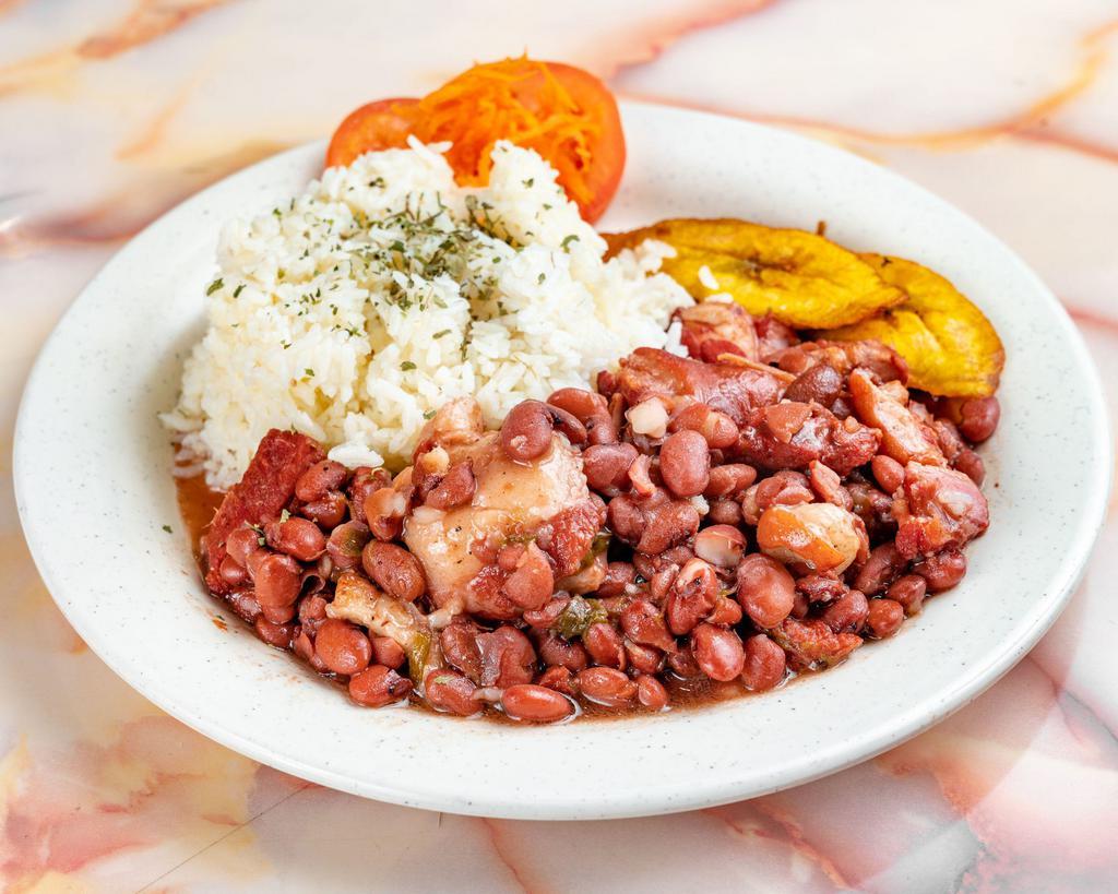 Stew Peas · Pieces of stew pork and oxtail emerged in a bed of red peas simmered to perfection.
