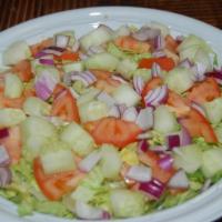 1. Garden Salad · Iceberg lettuce, tomato, red onion and cucumbers.