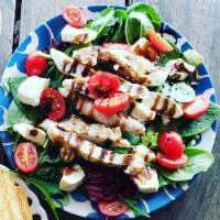 Grilled Chicken Caprese Salad · Cherry tomatoes, mozzarella, grilled chicken served on mixed greens and balsamic vinaigrette...