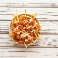 Buffalo Chicken Fries · Diced chicken tenders, Buffalo sauce, fries and drizzled ranch.
