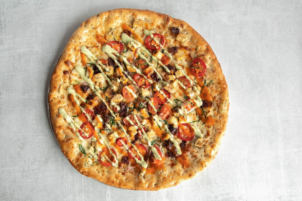 Spicy Buffalo Chicken Pizza · Roasted habanero ranch sauce, grilled chicken, red jalapeno, baby spinach, red onion, grape tomatoes, Buffalo sauce drizzle, mozzarella and bacon.