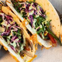 2 Veggie Tacos · Cheese-crusted flour tortilla, bell peppers, caramelized onions, mushrooms, baby spinach, re...