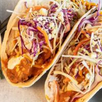 2 Buffalo Crispy Chicken Tacos · Buffalo fried chicken, bacon, coleslaw, shredded carrots, green onion, cheddar Jack with blu...