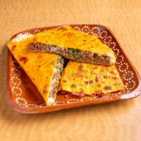Quesadilla Harina  · Cooked tortilla that is filled with cheese and folded in 1/2. 