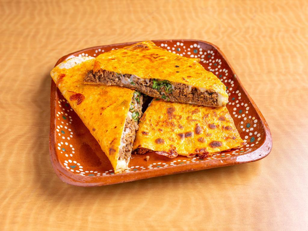 Quesadilla Harina  · Cooked tortilla that is filled with cheese and folded in 1/2. 