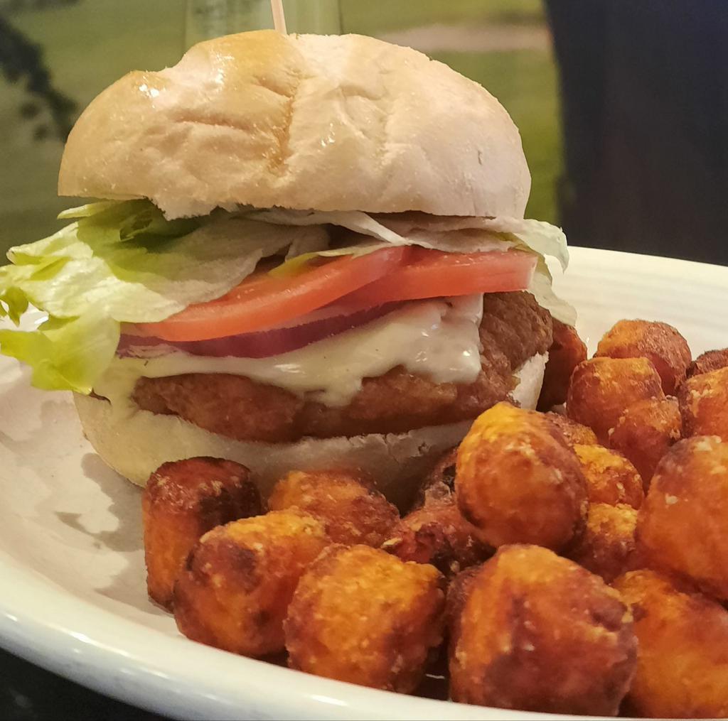 Crispy Chicken Breast Sandwich · Lettuce, tomato, pickle, onion and mayo. Add cheese and bacon for an additional charge.